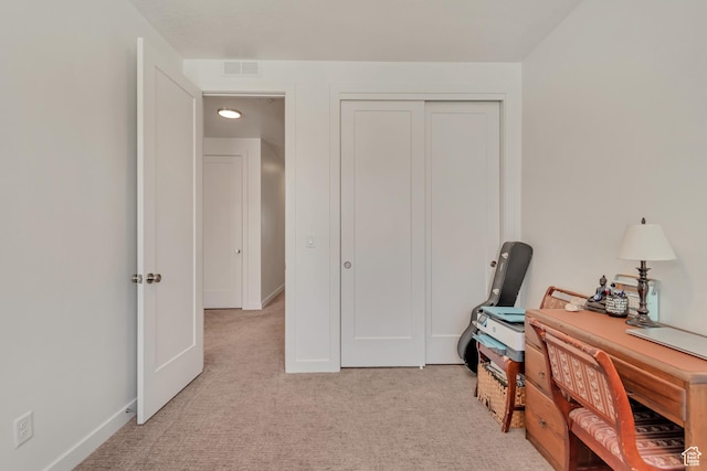 office space with light colored carpet and baseboards