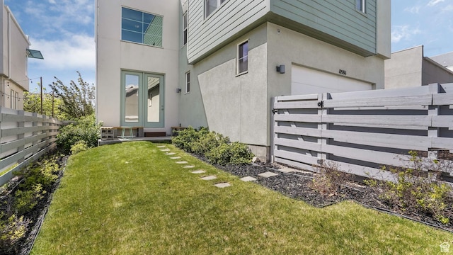 entrance to property featuring stucco siding and a garage