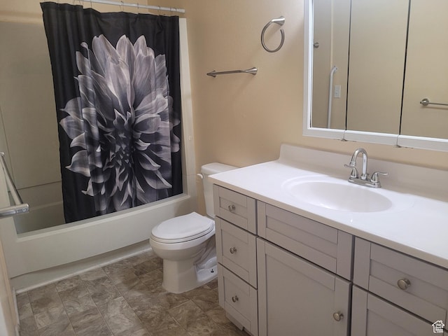bathroom with vanity, toilet, and shower / bath combo with shower curtain
