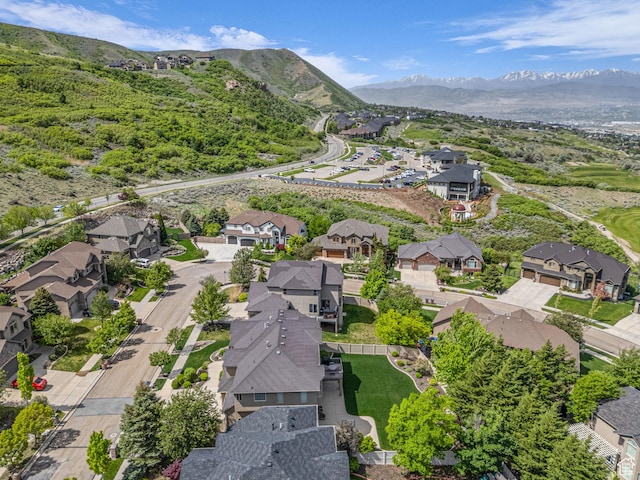 aerial view of residential area with mountains
