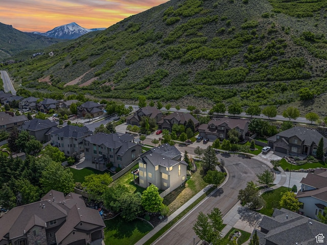 aerial view at dusk of a residential view and a mountain view