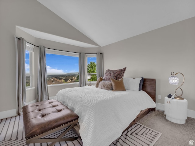 bedroom featuring vaulted ceiling, carpet floors, and baseboards