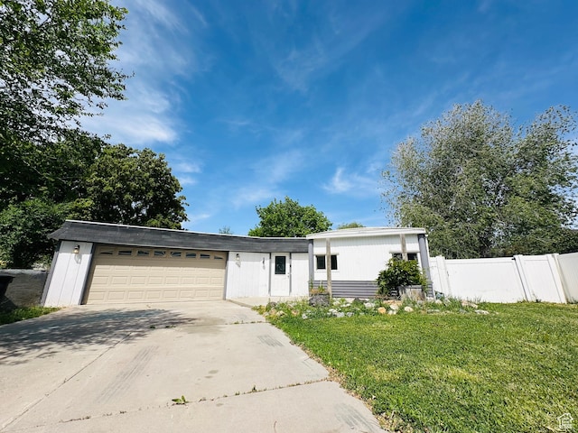 view of front of home featuring a garage and concrete driveway
