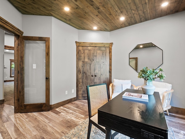 dining room featuring recessed lighting, light wood finished floors, baseboards, and wood ceiling