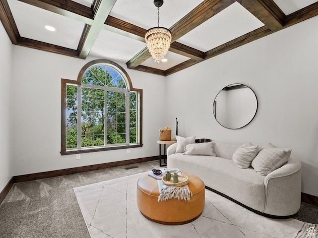 carpeted living area featuring coffered ceiling, a chandelier, baseboards, and beam ceiling