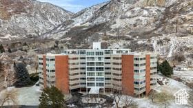 view of apartment building / complex with a mountain view