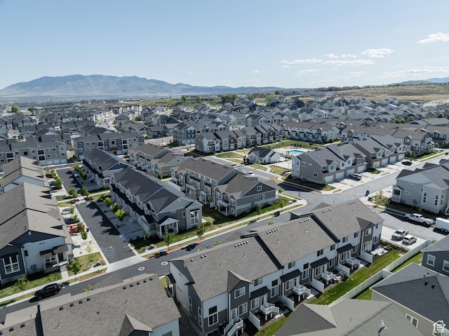 aerial perspective of suburban area with a mountainous background and property boundaries highlighted