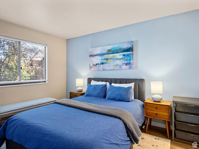 bedroom featuring wood finished floors