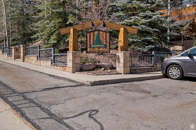 community sign featuring fence