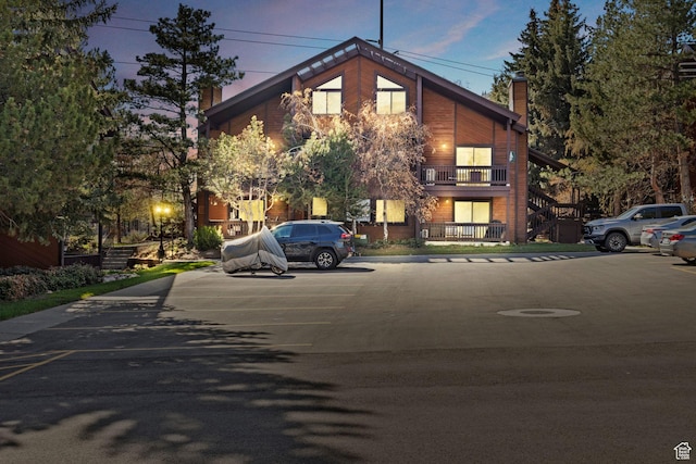 view of property with uncovered parking