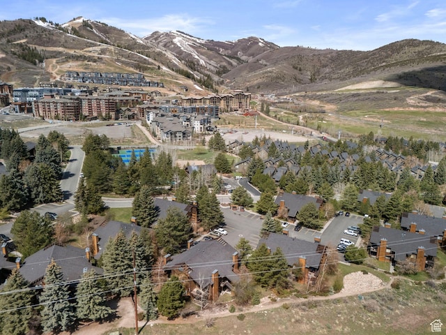 aerial view of property and surrounding area featuring mountains