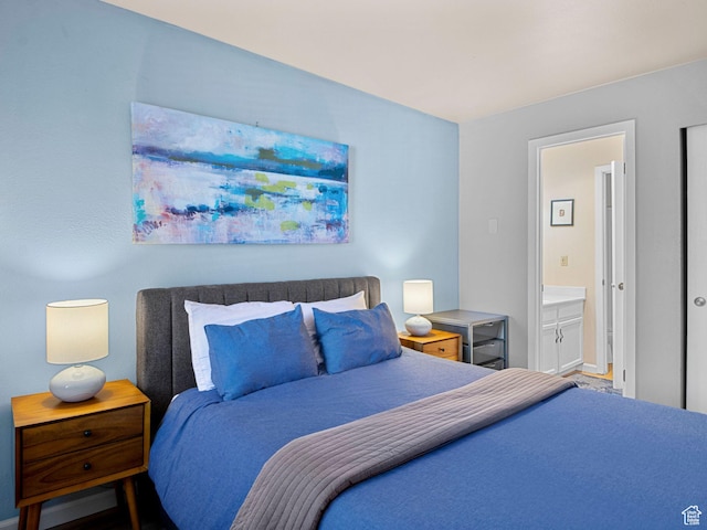 bedroom with connected bathroom