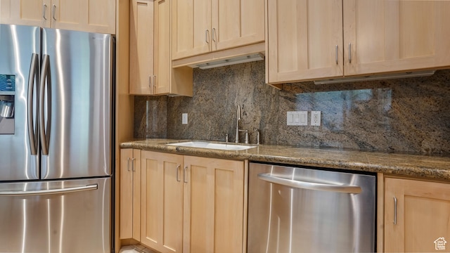 10804 S Lostwood Dr, Sandy, UT 84092 - kitchen featuring stainless steel appliances, light brown cabinetry, a sink, and backsplash