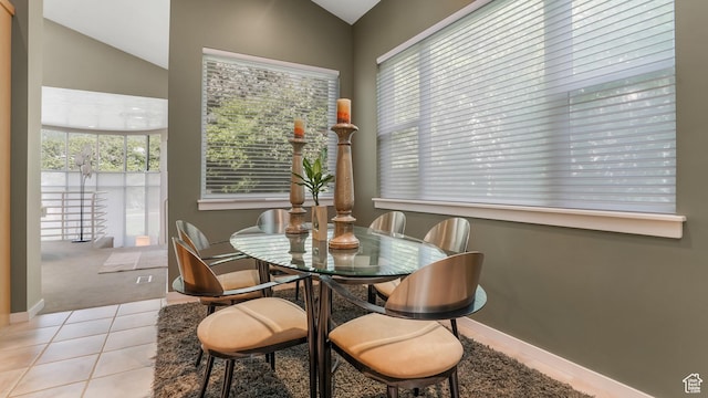 10804 S Lostwood Dr, Sandy, UT 84092 - carpeted dining room with lofted ceiling, tile patterned flooring, and baseboards