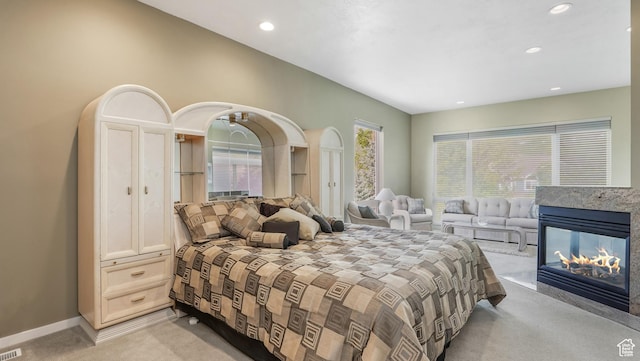 10804 S Lostwood Dr, Sandy, UT 84092 - bedroom with light colored carpet, recessed lighting, a multi sided fireplace, and baseboards