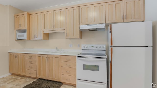 10804 S Lostwood Dr, Sandy, UT 84092 - kitchen with white appliances, light brown cabinets, under cabinet range hood, a sink, and light countertops