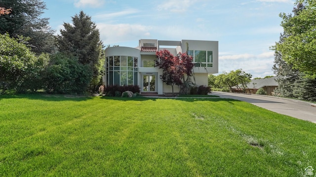 10804 S Lostwood Dr, Sandy, UT 84092 - view of front of property with stucco siding, french doors, and a front yard