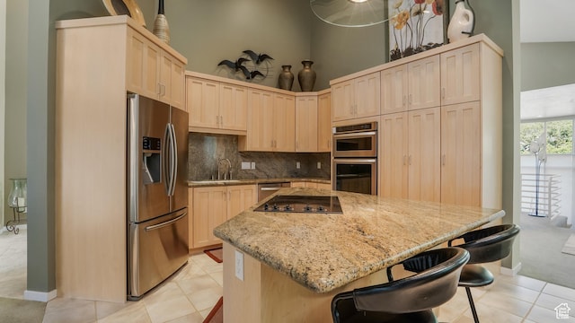 10804 S Lostwood Dr, Sandy, UT 84092 - kitchen with stainless steel appliances, light brown cabinetry, a kitchen island, backsplash, and a high ceiling