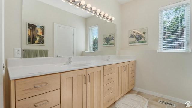 10804 S Lostwood Dr, Sandy, UT 84092 - bathroom with double vanity, tile patterned flooring, and baseboards