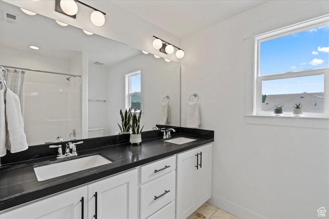 13741 S 3870 W, Riverton, UT 84065 - bathroom with double vanity, curtained shower, baseboards, and toilet