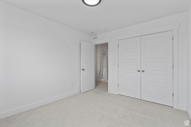13741 S 3870 W, Riverton, UT 84065 - unfurnished bedroom with light carpet, baseboards, and a closet
