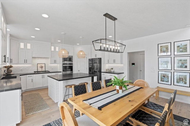 13741 S 3870 W, Riverton, UT 84065 - dining room featuring light wood-style floors, a chandelier, and recessed lighting
