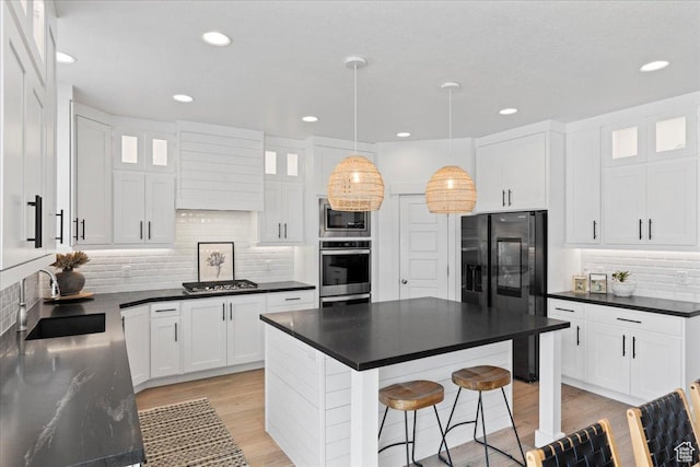 13741 S 3870 W, Riverton, UT 84065 - kitchen featuring a sink, stainless steel appliances, dark countertops, tasteful backsplash, and recessed lighting