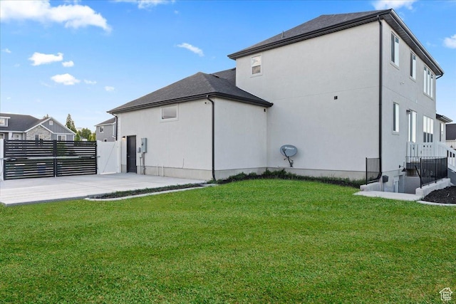 13741 S 3870 W, Riverton, UT 84065 - rear view of property featuring stucco siding and a patio
