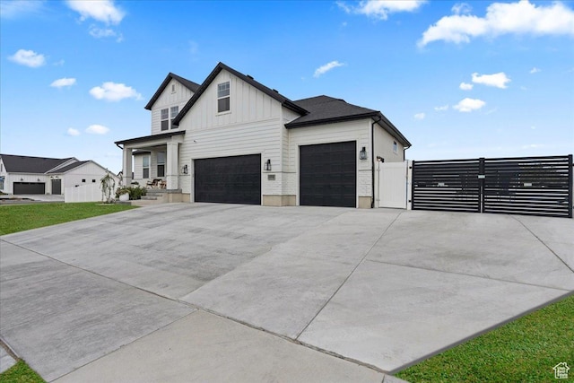 13741 S 3870 W, Riverton, UT 84065 - modern farmhouse featuring board and batten siding, a gate, concrete driveway, and a garage