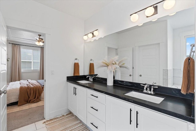 13741 S 3870 W, Riverton, UT 84065 - bathroom featuring double vanity, tile patterned floors, connected bathroom, and baseboards