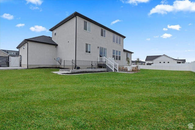 13741 S 3870 W, Riverton, UT 84065 - back of house with stucco siding, a gate, and a patio area