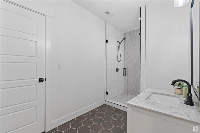13741 S 3870 W, Riverton, UT 84065 - bathroom with a stall shower, vanity, tile patterned floors, and baseboards
