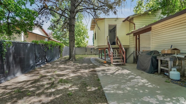 fenced backyard featuring a patio area