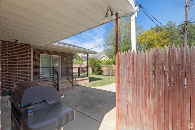 view of patio / terrace featuring fence and grilling area