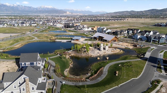 view of property location with nearby suburban area and a water and mountain view