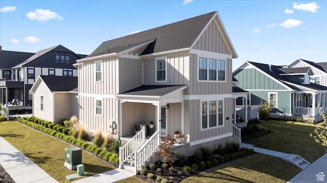 modern inspired farmhouse with board and batten siding, a porch, a residential view, and a front lawn