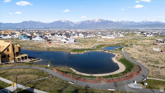 aerial view of residential area with a water and mountain view