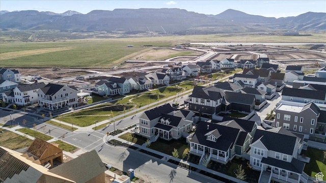 aerial view of residential area featuring a mountainous background
