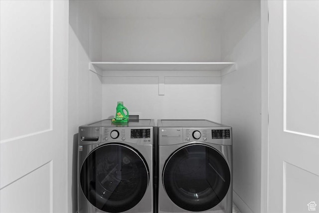laundry area featuring washing machine and clothes dryer