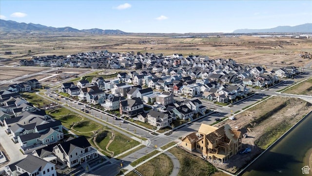 view of property location with mountains and nearby suburban area