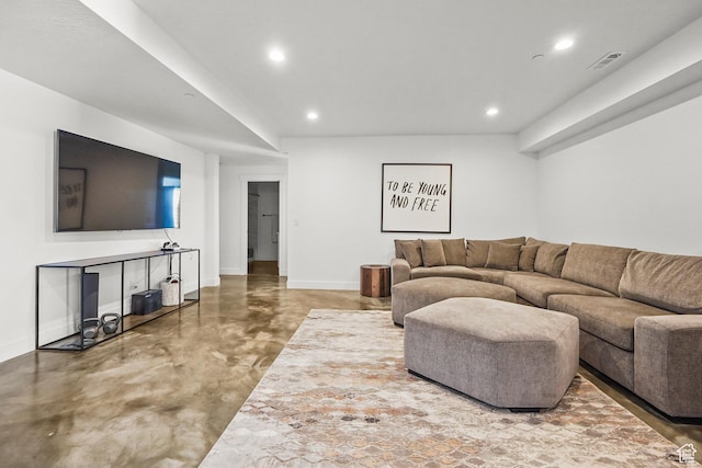 living room with concrete floors, baseboards, and recessed lighting