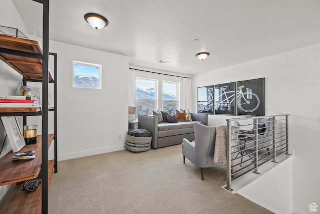 living room with carpet flooring and baseboards