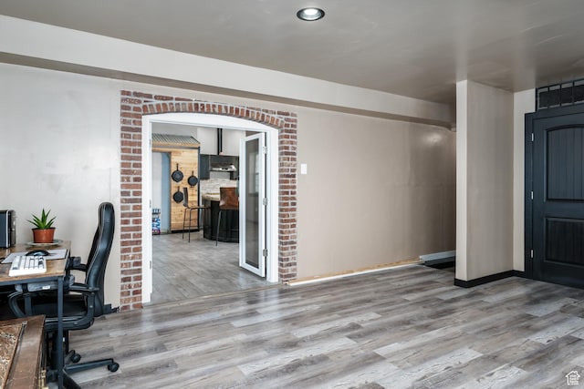 office space featuring wood finished floors and baseboards