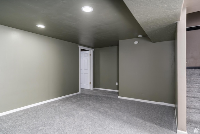 unfurnished room with carpet floors, baseboards, and recessed lighting