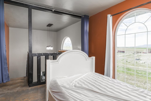 bedroom with wood finished floors