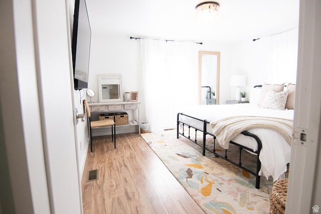 bedroom featuring light wood-type flooring