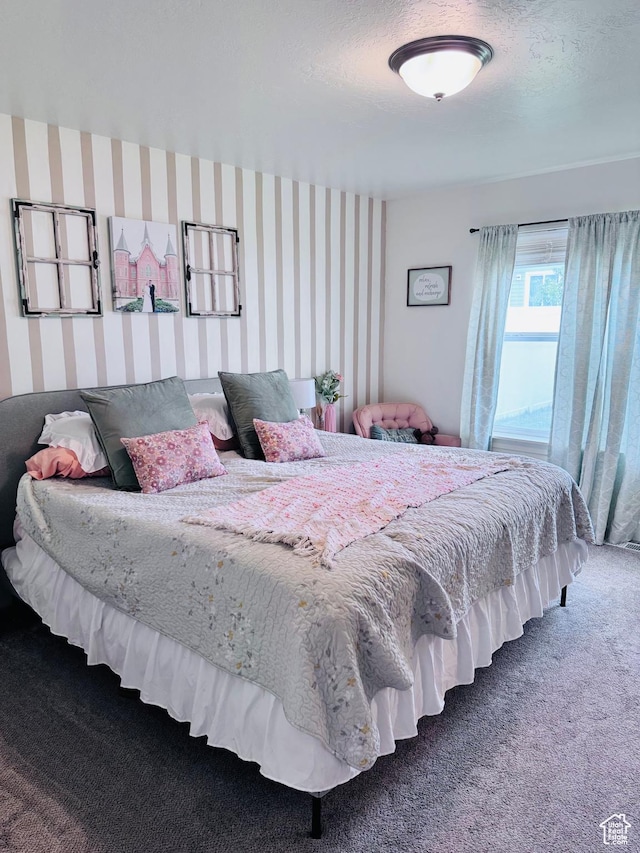 carpeted bedroom with wallpapered walls