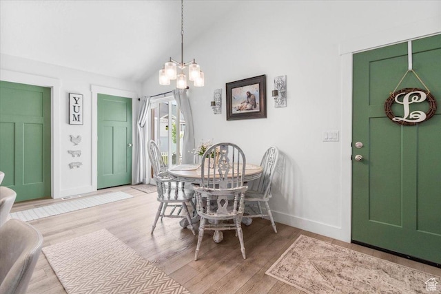 40 E 920 N, Santaquin, UT 84655 - dining area with baseboards, light wood-style flooring, vaulted ceiling, and a chandelier