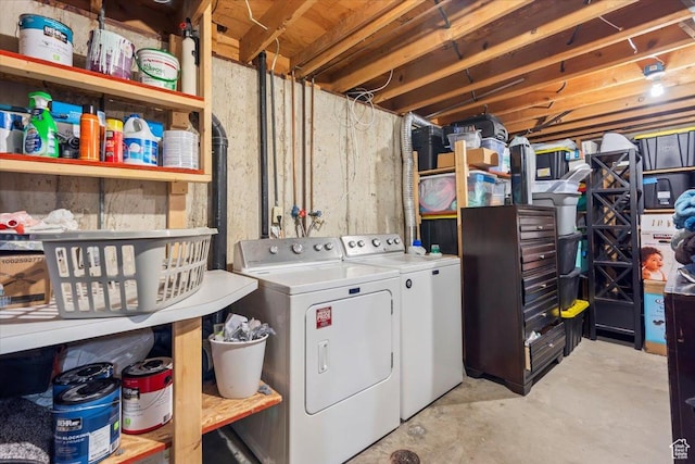 clothes washing area featuring washer and clothes dryer