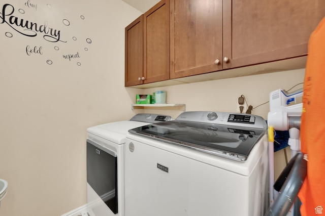 980 Woodstock Dr, North Salt Lake, UT 84054 - laundry room featuring washing machine and clothes dryer and cabinet space